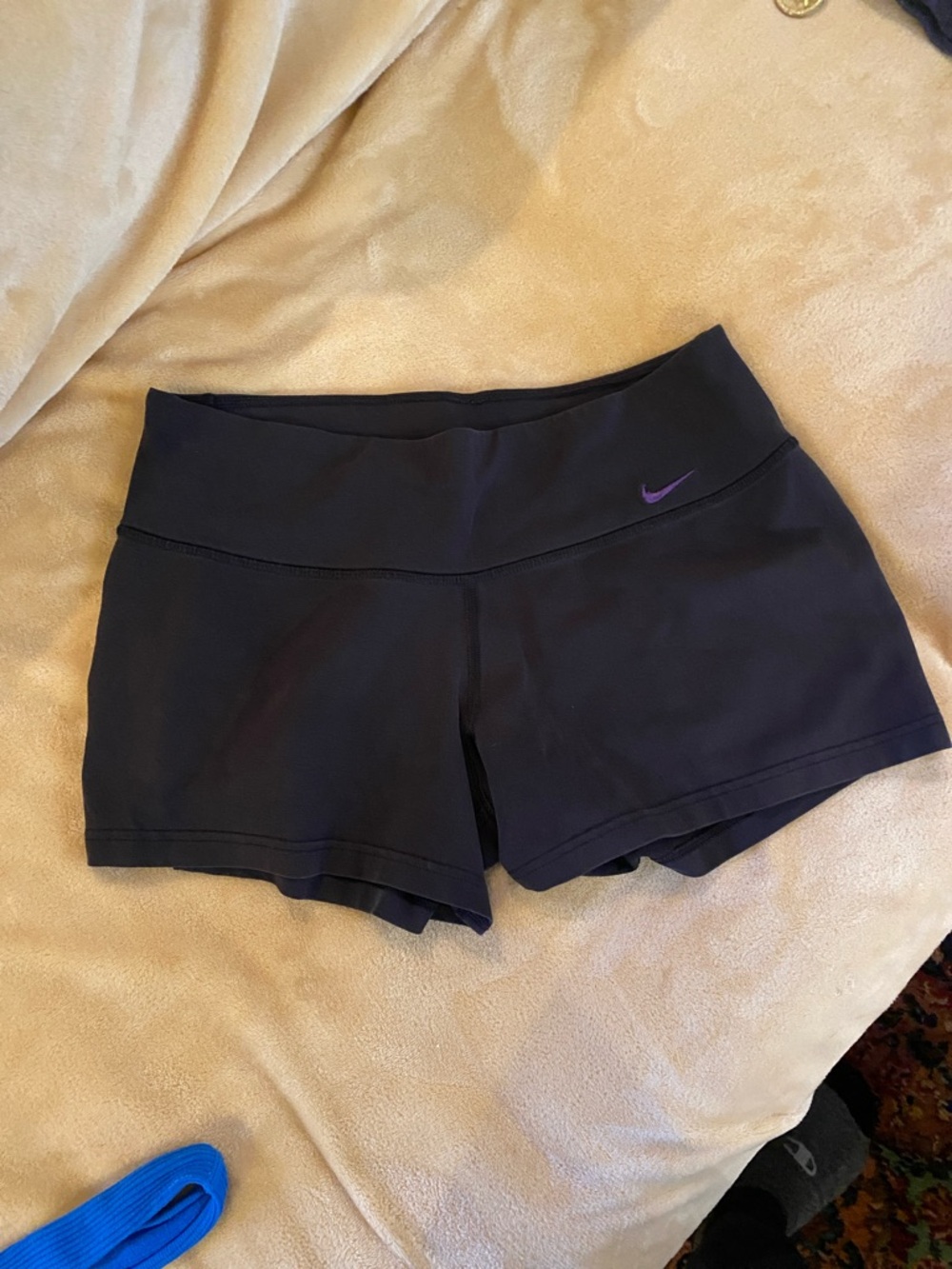 Nike Women’s Black Athletic Shorts with Purple Swoosh Accent